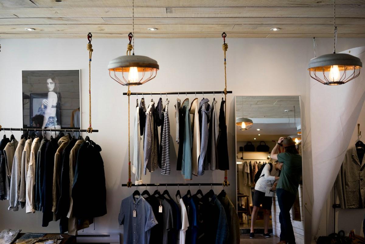 Clothing hanging on racks in a boutique